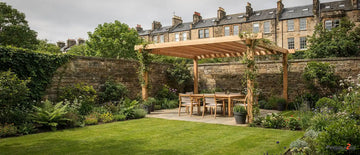 Edinburgh's unpredictable weather makes shelter-focused pergolas especially valuable for homeowners.; Louvered aluminium